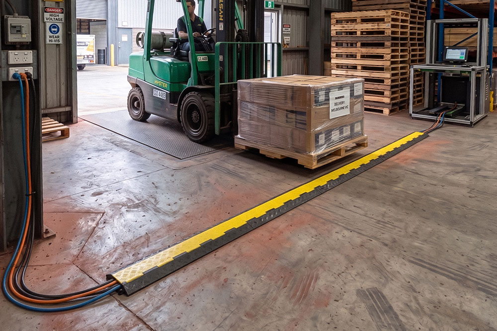 Warehouses & Logistics: Protecting cords from forklift damage across loading bays.